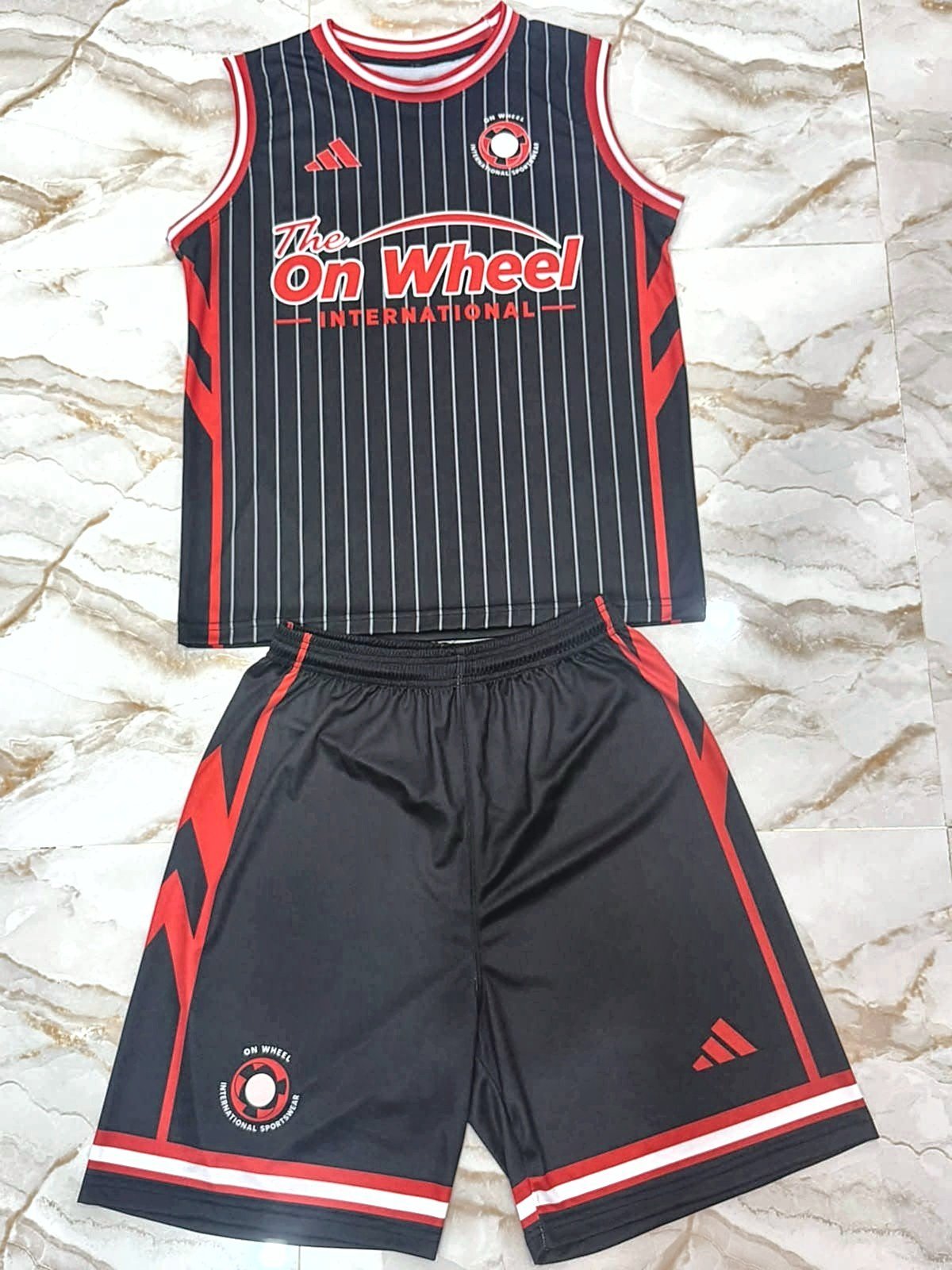 Black pinstripe vest and shorts set with red trim